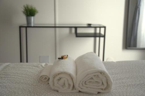 a couple of towels sitting on top of a bed at Mandala Bed & Breakfast in Viterbo