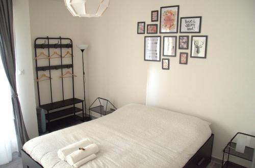 a bedroom with a bed and pictures on the wall at Mandala Bed & Breakfast in Viterbo