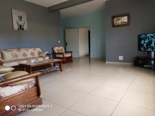 Zona de estar de Hotel Golden House