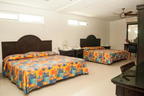 Katil atau katil-katil dalam bilik di Hotel Del Sol