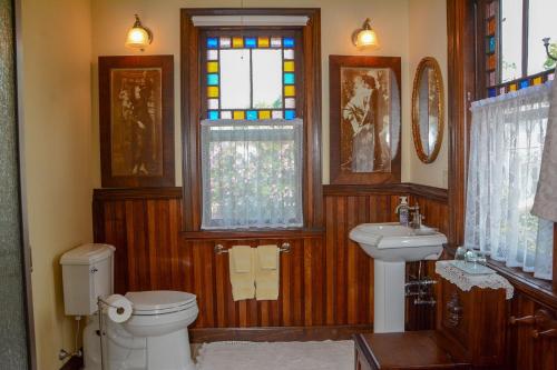 a bathroom with a toilet and a sink at The Towers Bed & Breakfast in Milford