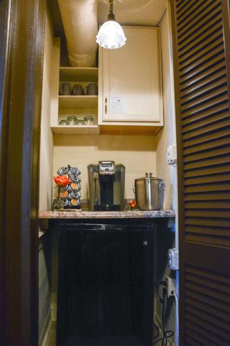a small kitchen with a counter top and a stove at The Towers Bed & Breakfast in Milford