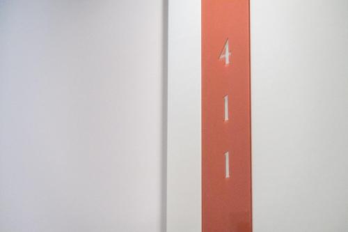 a red arrow on a white wall at Hotel San Giovanni Roma in Rome
