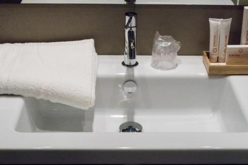 a sink with a faucet on top of it at Hotel San Giovanni Roma in Rome