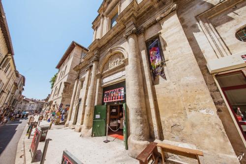 a building on the side of a street at Les Précieuses Suites & Spa I in Avignon