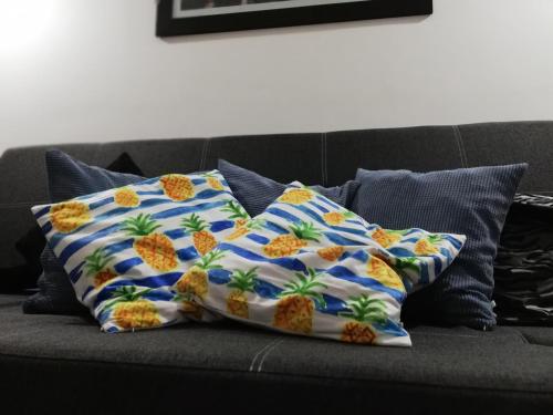 a pillow sitting on top of a couch at Departamento Víctoria in Mar del Plata