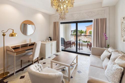 a living room with a table and a desk at Sanctuary Cap Cana, a Luxury Collection Resort, Dominican Republic, Adult All-Inclusive in Punta Cana