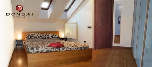 Ένα ή περισσότερα κρεβάτια σε δωμάτιο στο Bonsai Apartment