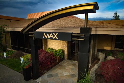 a sign in front of a building that says max at Mirabeau Park Hotel in Spokane Valley