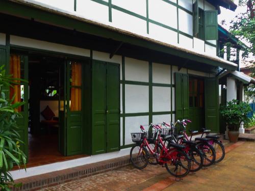 a group of bikes parked outside of a building at Maison Houng Chanh - Luang prabang in Luang Prabang