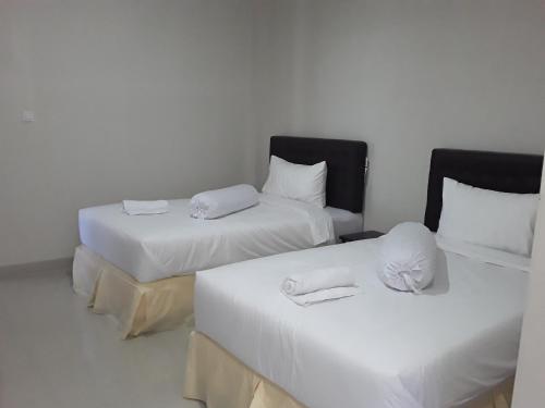 Postel nebo postele na pokoji v ubytování Victory Hotel