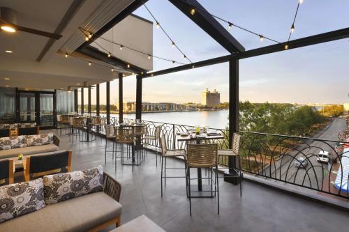 a living room filled with furniture next to a river at Hyatt Regency Savannah in Savannah
