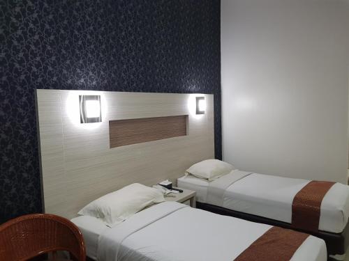 Cama o camas de una habitación en The K Hotel