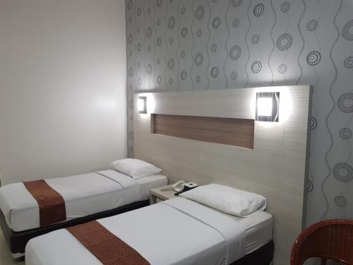 Cama o camas de una habitación en The K Hotel