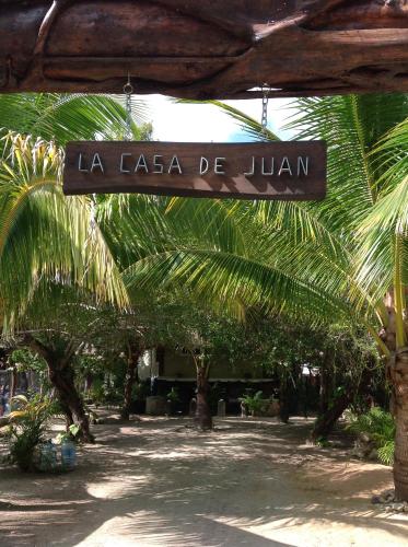 a sign that reads la ica be juan at La Casa de Juan in Holbox Island