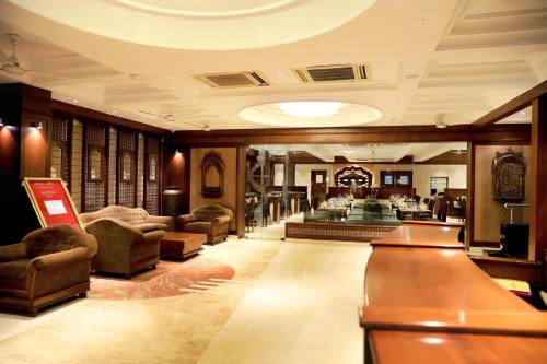 a large lobby with couches and a salon at Hotel Niky International in Jodhpur