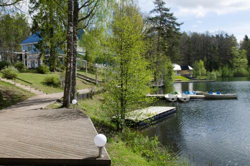 a dock with two boats on the water at Nelijärve Holiday Centre in Aegviidu