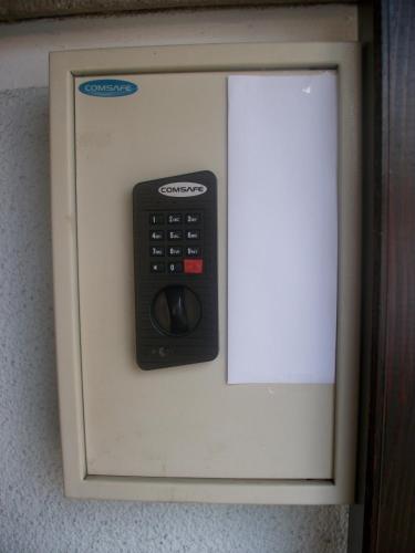 a telephone booth with a remote control on it at Haus Alpenrose in Schwangau