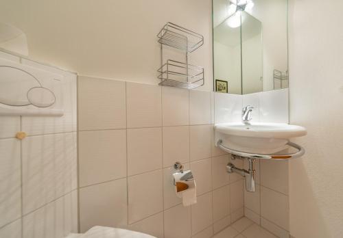 a bathroom with a sink and a shower at Casa Serena in Arosa
