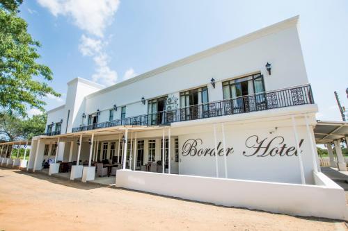 a white building with a sign that reads boiler house at Border Hotel in Jan Kempdorp