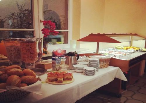 a table with food on top of it at Hotel Jägerhof in Roth