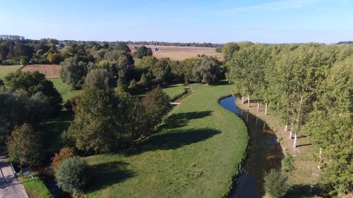 an aerial view of a river and trees at Charmes de Velupont with Wellness in Braives