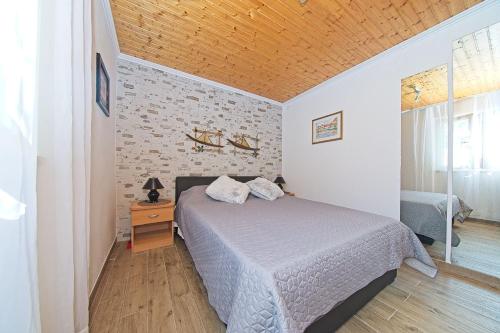 Postel nebo postele na pokoji v ubytování Lovely apartment Silvana
