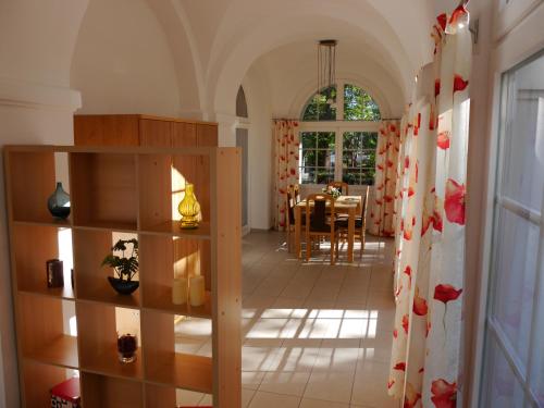 a room with a table and a dining room at Villa Parkhaus in Wernigerode