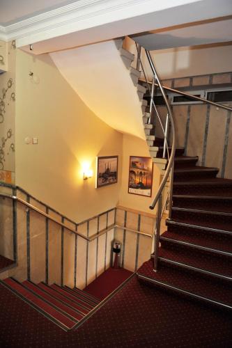 a staircase in a building with a stair case at Saray Hotel in Edirne