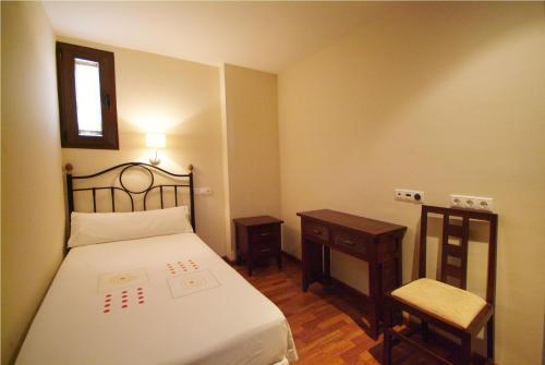 Ένα ή περισσότερα κρεβάτια σε δωμάτιο στο Apartamentos Ardales