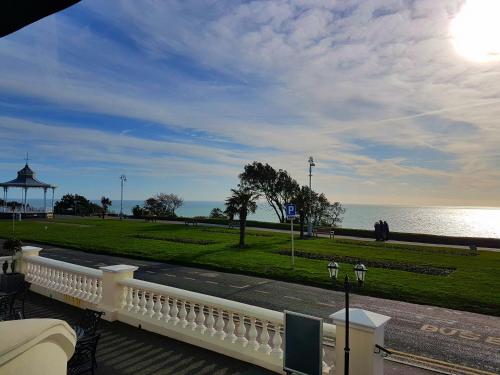 a balcony with a view of a park and the ocean at The View Hotel Folkestone, a member of Radisson Individuals in Folkestone