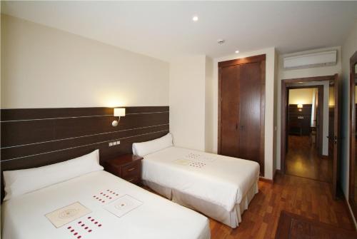 Ένα ή περισσότερα κρεβάτια σε δωμάτιο στο Apartamentos Ardales