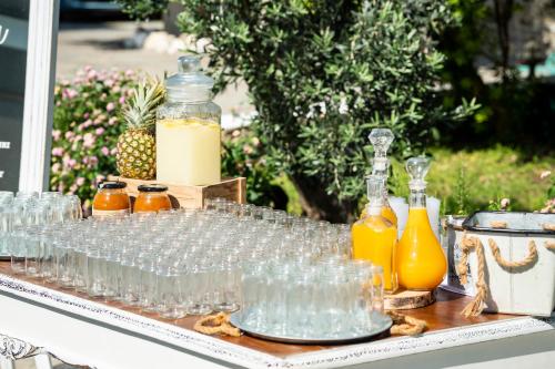 a table with glasses and bottles of orange juice at Pyrgaki Hotel in Parikia