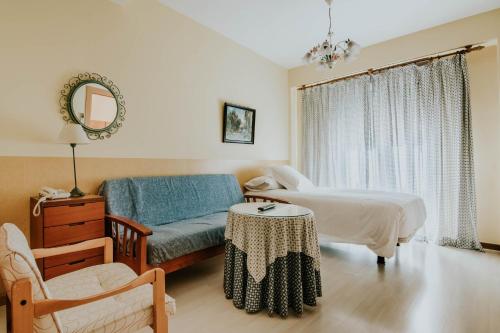 Postel nebo postele na pokoji v ubytování Hotel Isasa