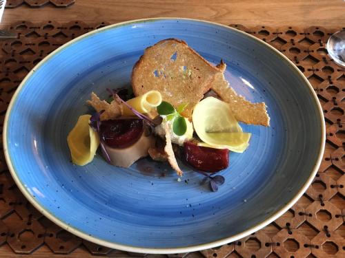 a blue plate with food on a table at Bulwary Biznes in Mielec