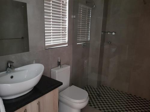 Ένα μπάνιο στο Presidensie Guest Rooms