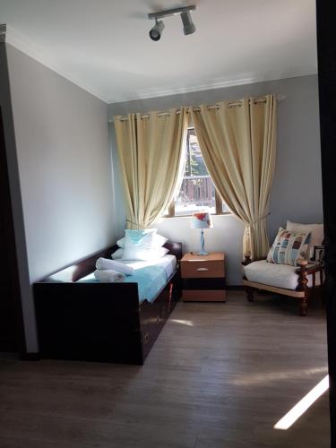 a bedroom with a bed and a window at Venti Dell'Est in Westbrook