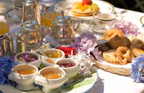 a table with a plate of food on a table at Hotel Villa Cimbrone in Ravello