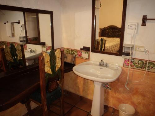 a bathroom with a sink and a mirror at Hotel el Fuerte in El Fuerte