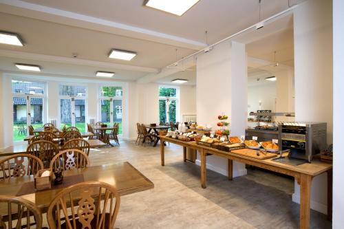 a dining room with a table with food on it at The Royal Foundation of St Katharine in London