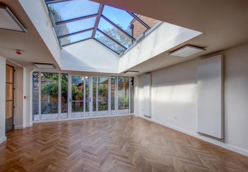 an empty room with a skylight in a house at The Royal Foundation of St Katharine in London