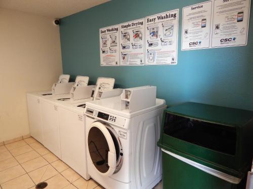a laundry room with a washer and dryer at InTown Suites Extended Stay Lewisville TX - East Corporate Drive in Lewisville