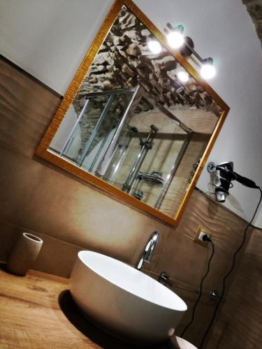 a bathroom with a sink and a mirror at Dormire nel Borgo in Bovino