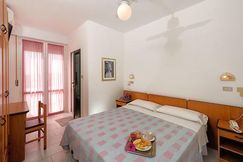 Postel nebo postele na pokoji v ubytování Hotel Samoa