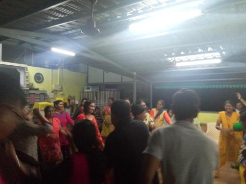 a group of people standing in a room at Shreyas Guest house - Tatkare Villa in Kashid