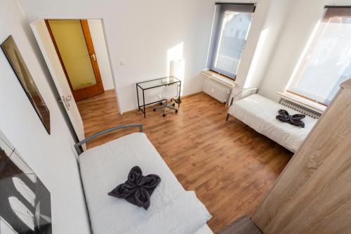 a view of a living room with a bow on a chair at AVR Apartment HOF 7 in Bremerhaven