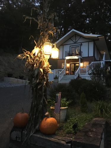a house with pumpkins in front of it at night at Grafton Lodge in Lake Lure