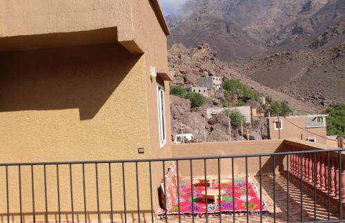 a balcony of a building with a view of a mountain at Dar Imperial in Imlil