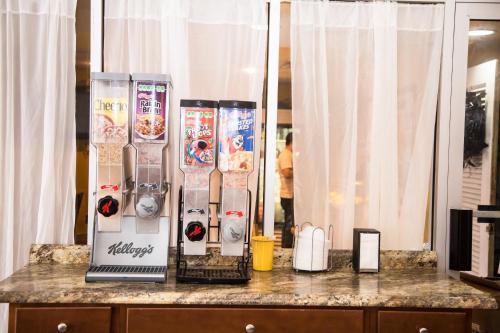 a counter with a machine on top of it at Days Inn by Wyndham Alexandria South in Alexandria