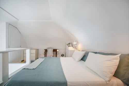 Katil atau katil-katil dalam bilik di Corricella Sea Window - Gioia Apartments